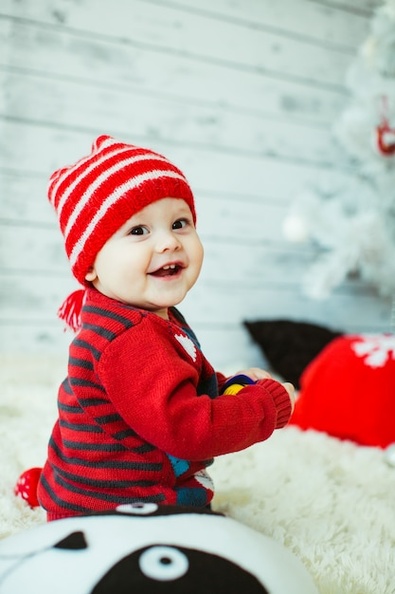 cute-little-boy-red-striped-hat-sits-floor_1304-4935.jpg