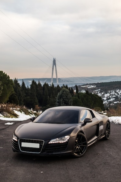 luxury-black-sport-coupe-parking-road_114579-4017.jpg