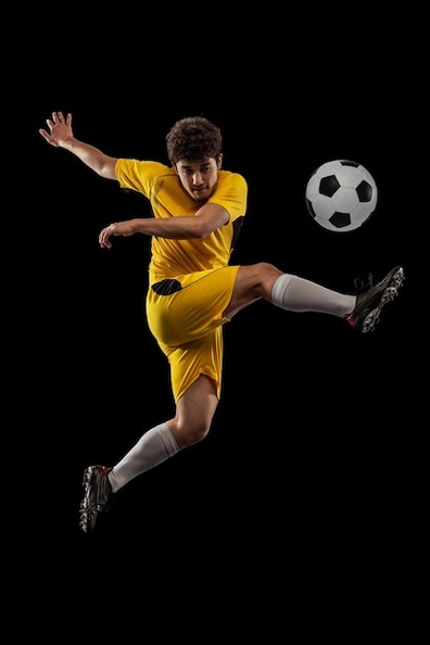 portrait-young-man-football-playing-motion-training-isolated-black-studio-background-kicking-ball_155003-46280.jpg