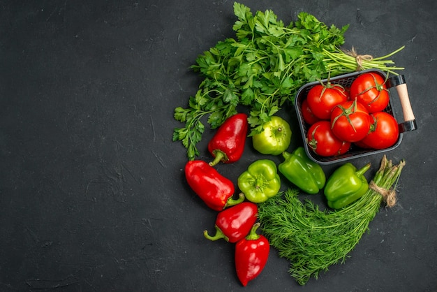 top-view-fresh-red-tomatoes-with-greens-bell-peppers-dark-background_140725-137148.jpg