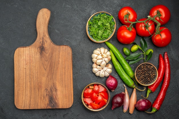 top-view-from-afar-vegetables-vegetables-herbs-spices-onion-hot-pepper-cutting-board_140725-71265.jpg