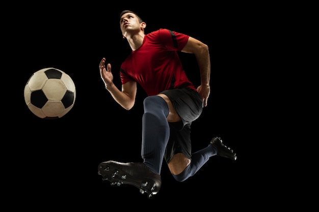 young-caucasian-football-soccer-player-action-motion-isolated-black-background_155003-32525.jpg